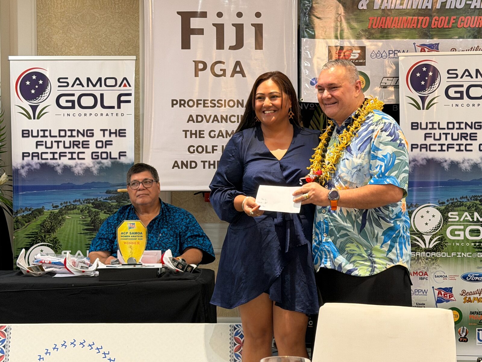 A Samoa Open competitor receiving an award during the closing function