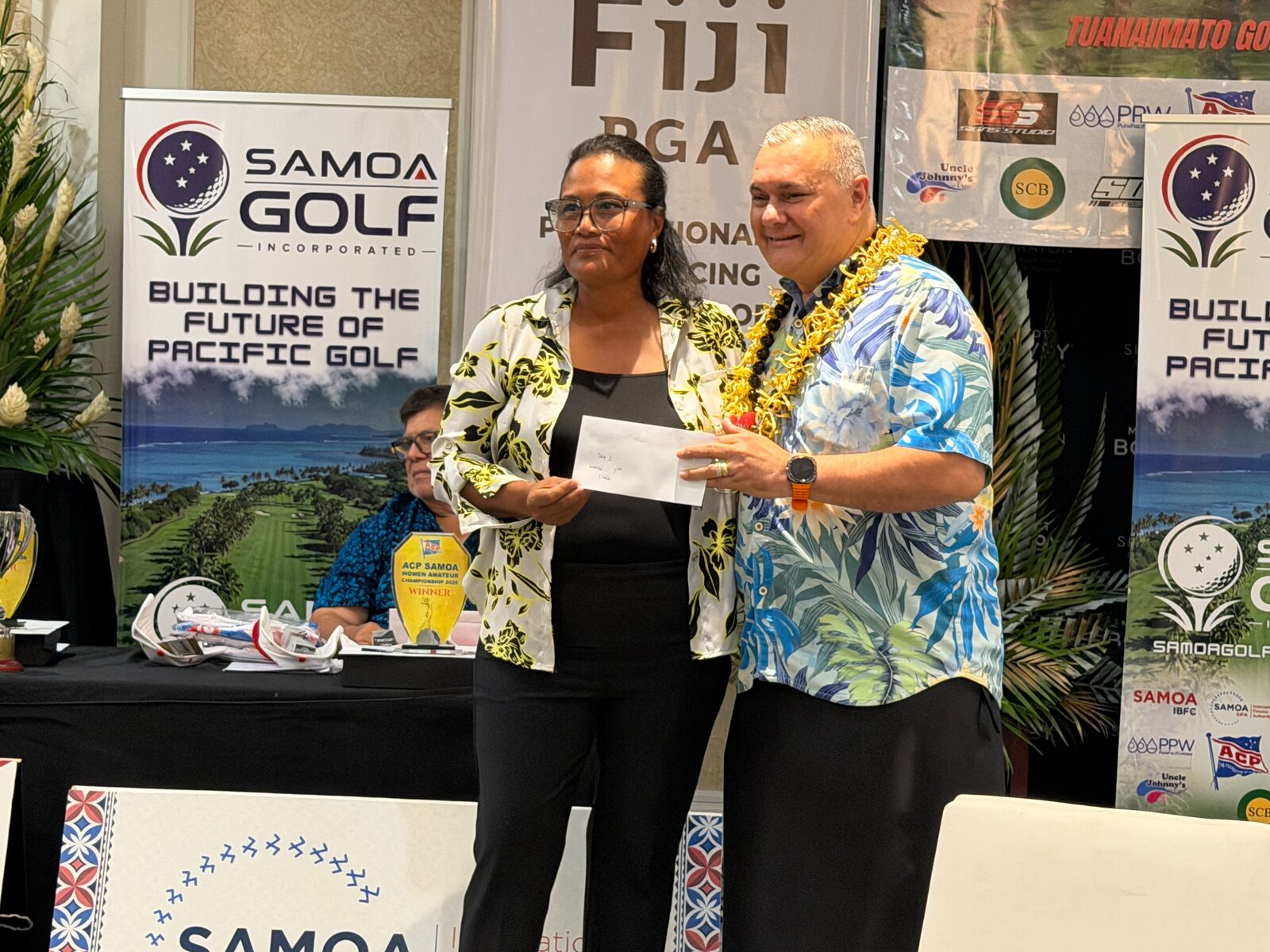 A Samoa Open competitor receiving recognition during the closing function