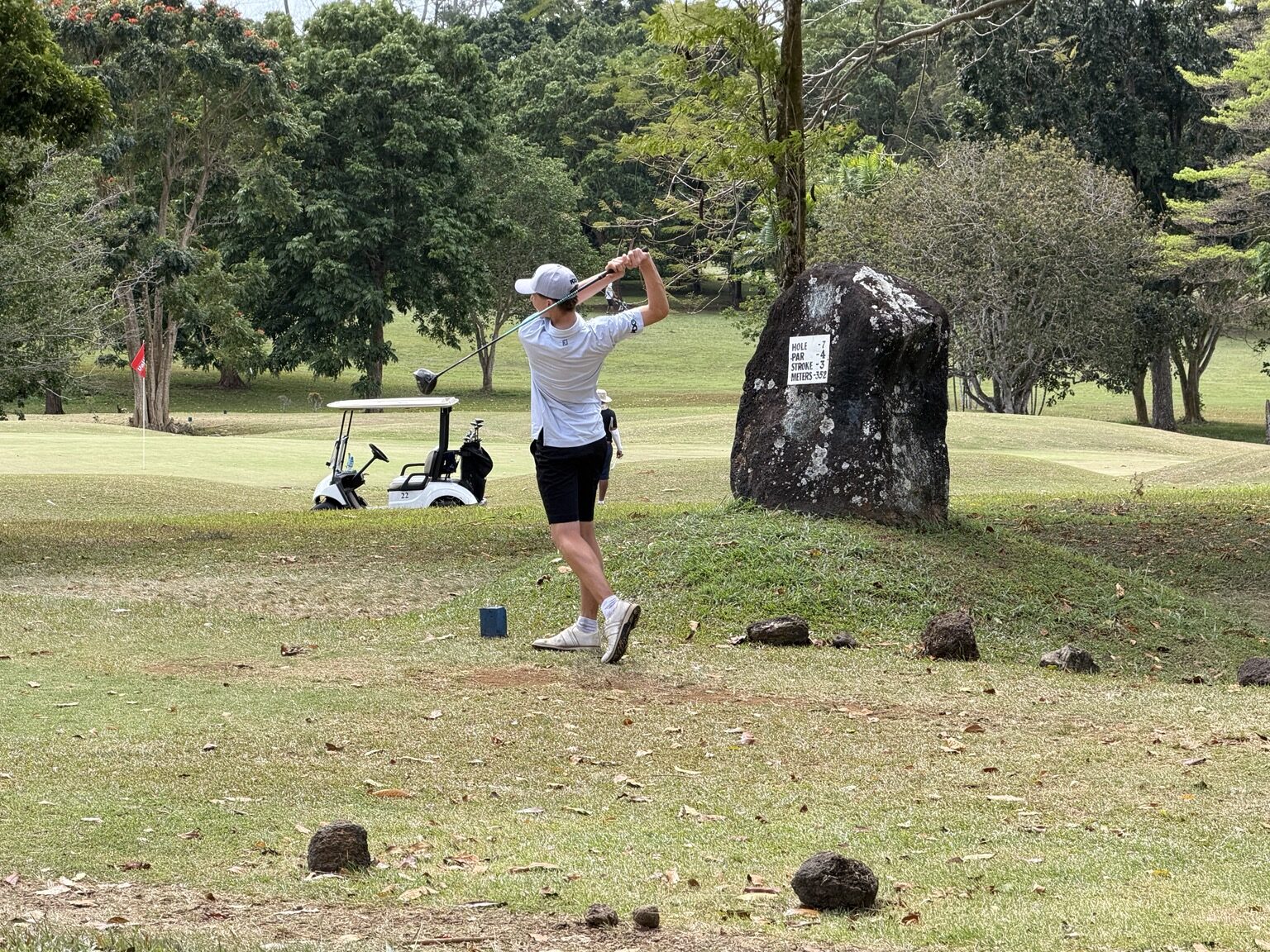A golfer completing a tee shot on the Faleata course