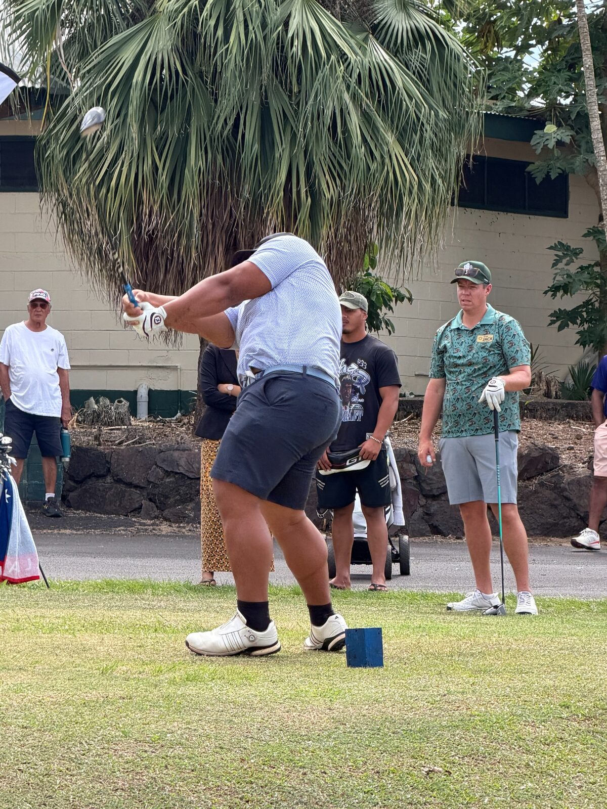A woman golfer completing her swing during the Samoa Open